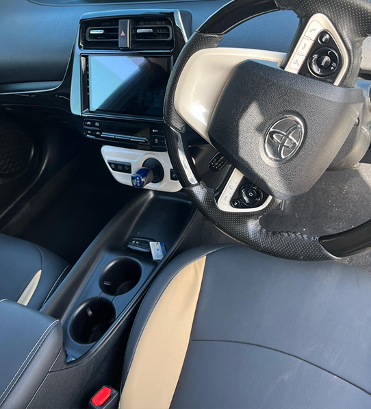 Taxi car rental near me Leicester Prius dashboard